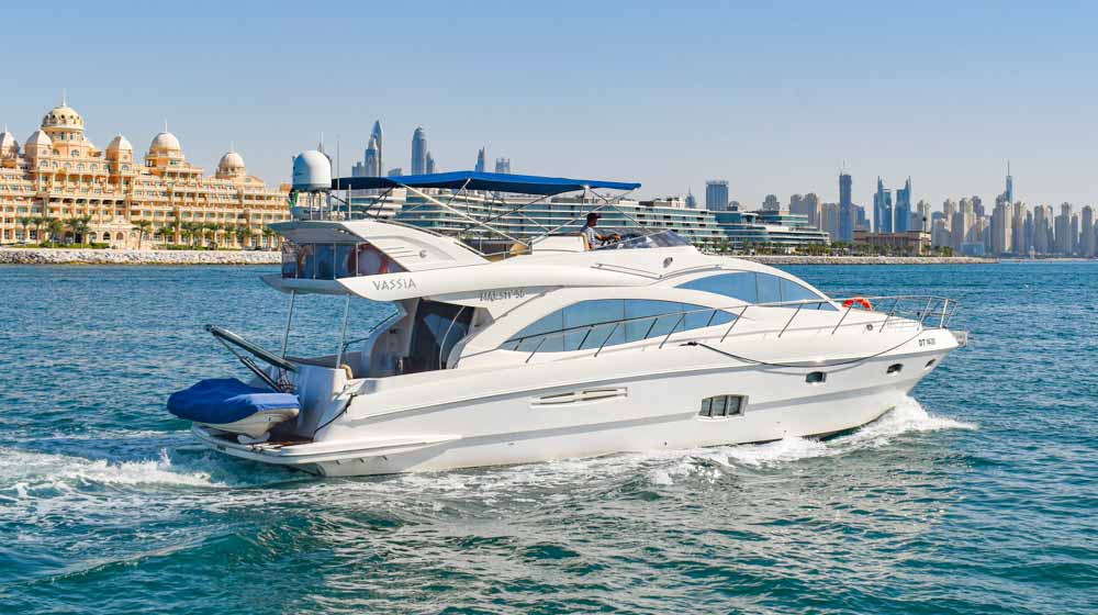 luxury yacht cruising near Raffles The Palm hotel in Dubai